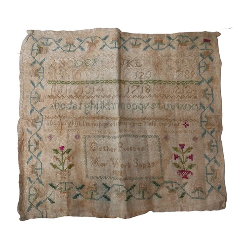 21 - A George IV textile sampler, by Esther Reeves and dated 1828, 26 by 28cm, unframed and folded.