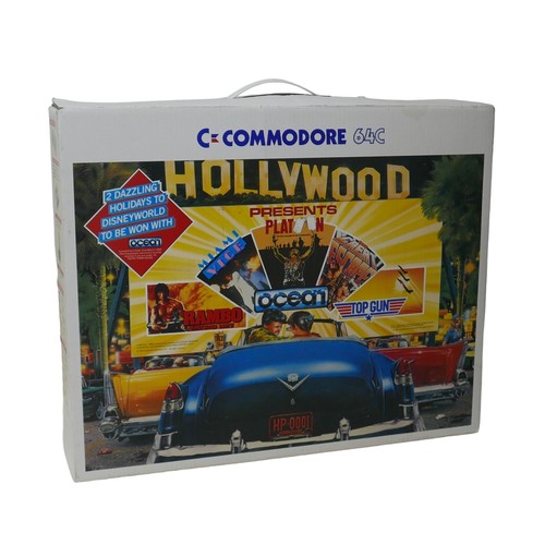 23 - A Commodore C64C Hollywood/TV Quiz pack, with C64 computer and manual, a Quickshot II joystick, a Co... 