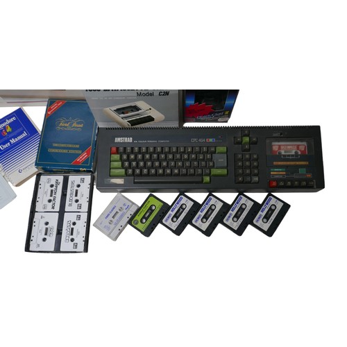 23 - A Commodore C64C Hollywood/TV Quiz pack, with C64 computer and manual, a Quickshot II joystick, a Co... 