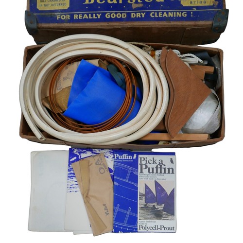 37 - A vintage Roseacre laundry box, containing parts for a Puffin dinghy/life raft, including instructio... 