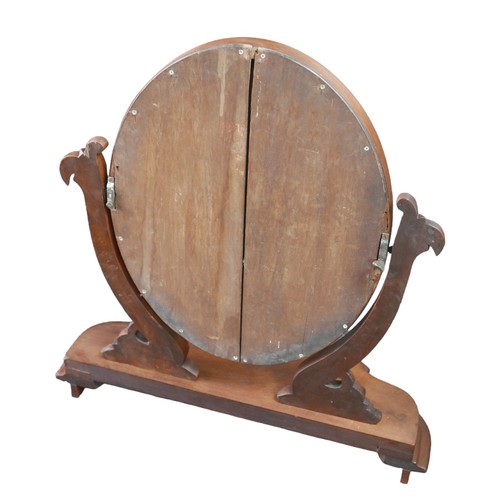 43 - A Victorian mahogany oval swing frame toilet mirror, 62 by 24 by 66.5cm high.