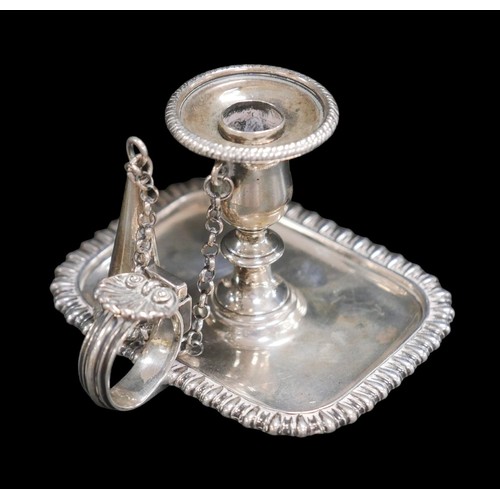 61 - A George III small silver chamber stick, with shell mount to handle, engraved monogram to its base, ... 