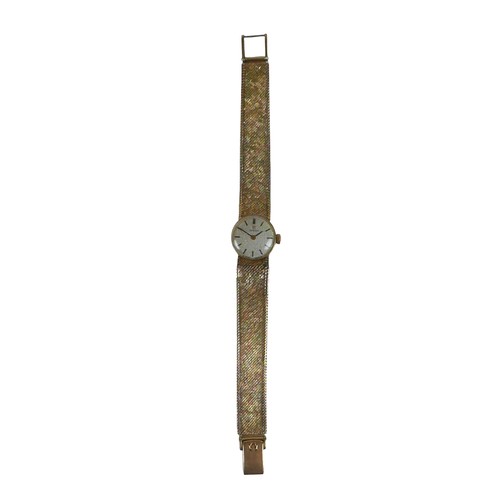 66 - A lady’s Omega 9ct gold wristwatch, gold case and bracelet, silvered dial and golden baton hour mark... 