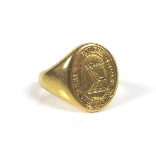 70 - A yellow metal armorial signet ring, no hallmarks, size K, 7.8g, with original box.