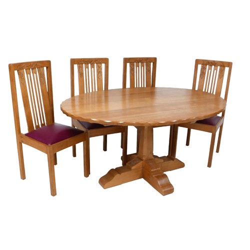 416 - A Wren Craftsman Sherwood oak oval dining table, with carved wren signature and carved decoration, 1... 