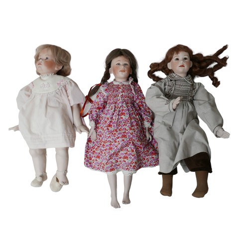 134 - Three hand made and hand painted reproduction bisque dolls, all with impressed marks of back of neck... 