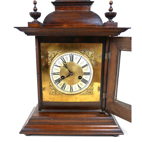 120 - An Edwardian mahogany mantel clock, architectural case with finials, 33 by 19 by 53cm, chime on coil... 