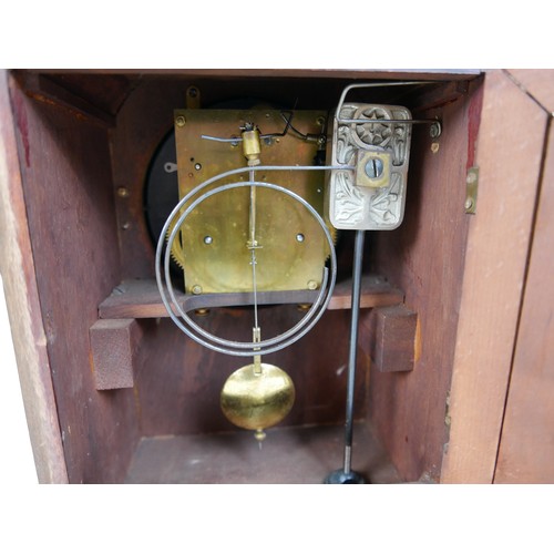 121 - An Edwardian Junghans mahogany mantel clock, silvered dial, with pendulum, chime on coil, 26 by 16 b... 