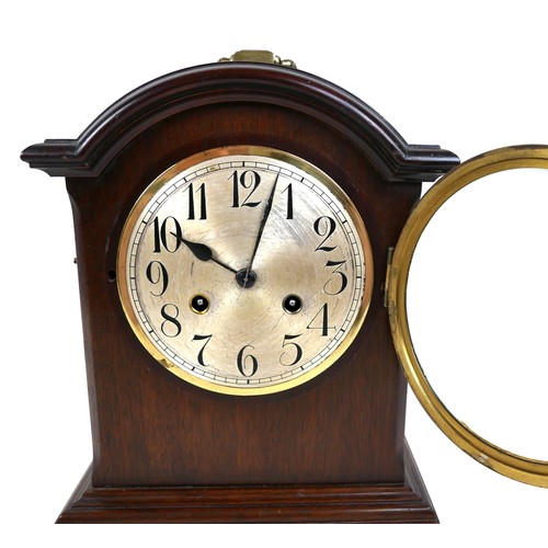 121 - An Edwardian Junghans mahogany mantel clock, silvered dial, with pendulum, chime on coil, 26 by 16 b... 