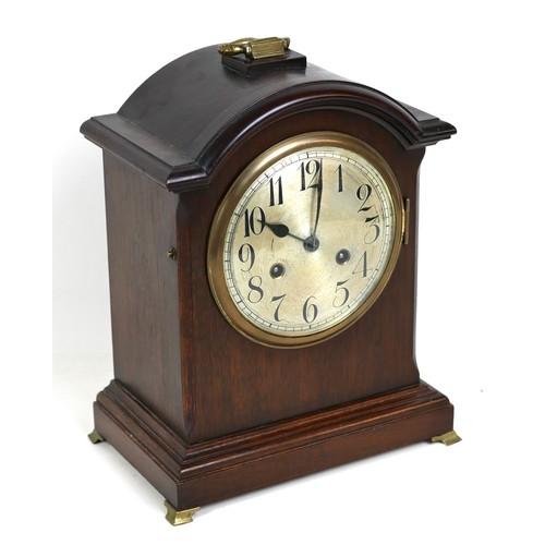 121 - An Edwardian Junghans mahogany mantel clock, silvered dial, with pendulum, chime on coil, 26 by 16 b... 