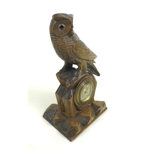 123 - A Black Forest carved wood mantel clock in the form of an owl, mid 20th century, 27.5 by 16 by 11.5c... 