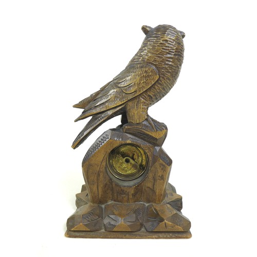 123 - A Black Forest carved wood mantel clock in the form of an owl, mid 20th century, 27.5 by 16 by 11.5c... 