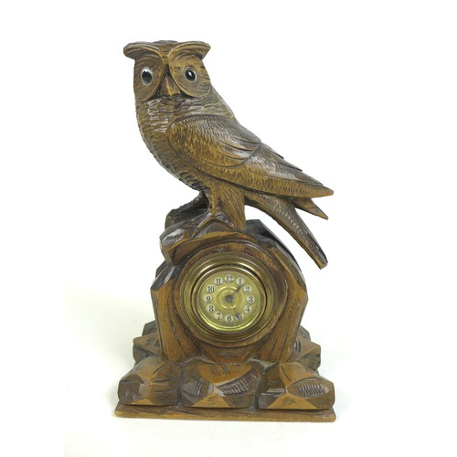 123 - A Black Forest carved wood mantel clock in the form of an owl, mid 20th century, 27.5 by 16 by 11.5c... 