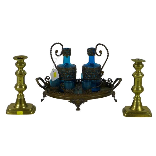 88 - A Continental blue glass and cast metal liqueur set, tray, two decanters, and six cups, 21cm high ov... 