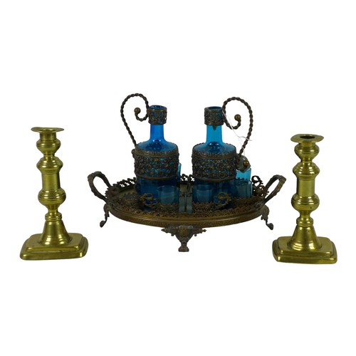 88 - A Continental blue glass and cast metal liqueur set, tray, two decanters, and six cups, 21cm high ov... 