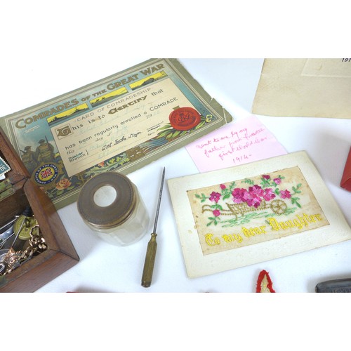 102 - A mixed group of collectables, including military memorabilia and badges, postcards, British coins a... 