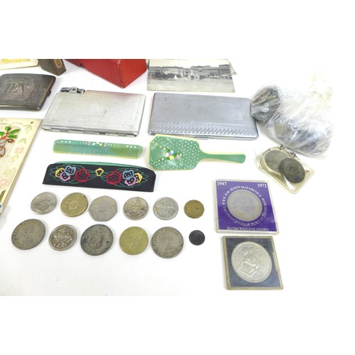 102 - A mixed group of collectables, including military memorabilia and badges, postcards, British coins a... 