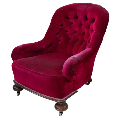 398 - A Victorian tub armchair, red velvet buttoned upholstery, cup feet castors, 91 by 73 by 83.5cm high.