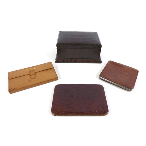 104 - A collection of vintage leather goods, comprising an Asprey of London leather gaming wallet; two cro... 