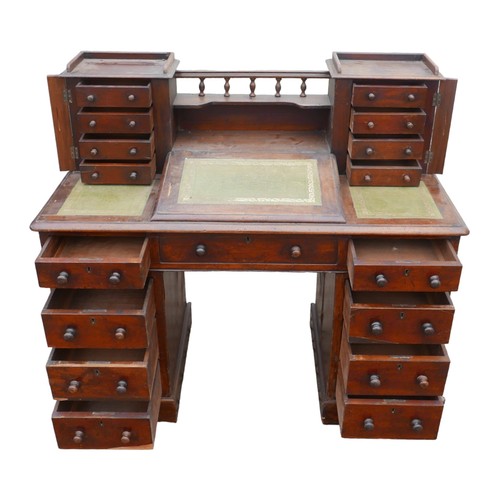 404 - A Victorian mahogany pedestal desk, with an arrangement of drawers, green leather skivver with centr... 