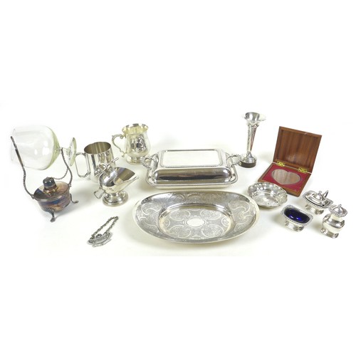 82 - A group of silver plated wares, including a brandy warmer, tureen and cover, condiment set, tankard,... 