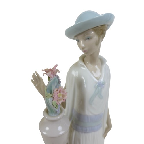 63 - Three 1920s style Lladro lady figurines, comprising 'Lady Grand Casino', #5175, 34.5cm high; 'Couple... 