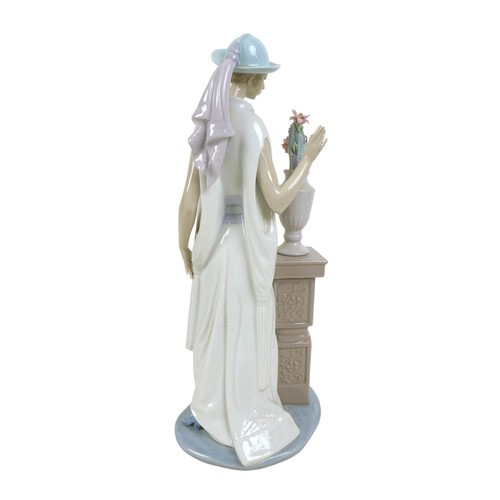 63 - Three 1920s style Lladro lady figurines, comprising 'Lady Grand Casino', #5175, 34.5cm high; 'Couple... 