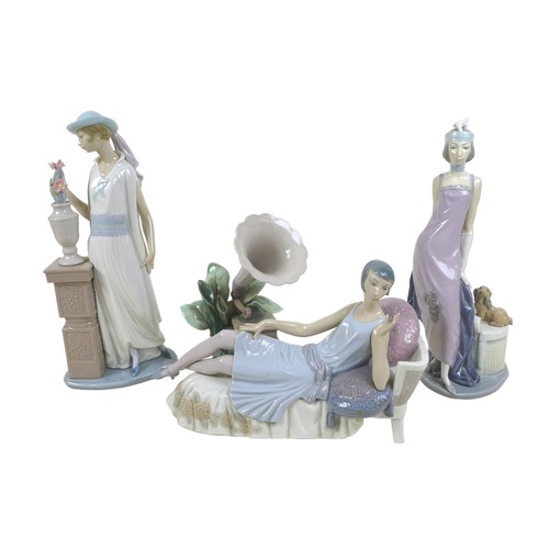 63 - Three 1920s style Lladro lady figurines, comprising 'Lady Grand Casino', #5175, 34.5cm high; 'Couple... 