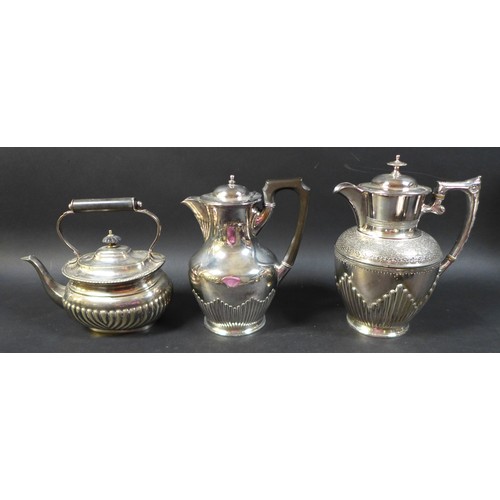 84 - A group of silver plated wears, including a pair of candelabras, tea and coffee pots, a group of blu... 