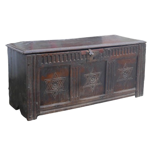 405 - A 16th or 17th century oak chest, the three panel front carved with six pointed stars, a/f replaceme... 