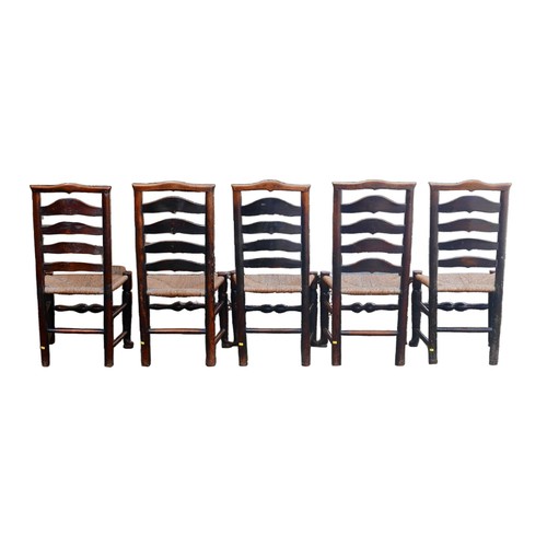 390 - A set of five 18th century oak country ladderback chairs, with rush seats. (5)