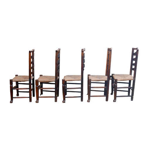 390 - A set of five 18th century oak country ladderback chairs, with rush seats. (5)