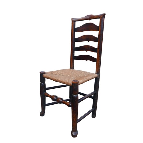 390 - A set of five 18th century oak country ladderback chairs, with rush seats. (5)