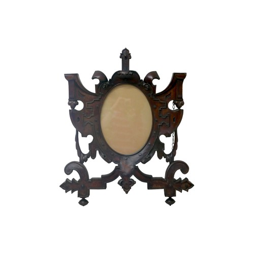 75 - An ornate wooden picture frame, 79.5 by 67cm.