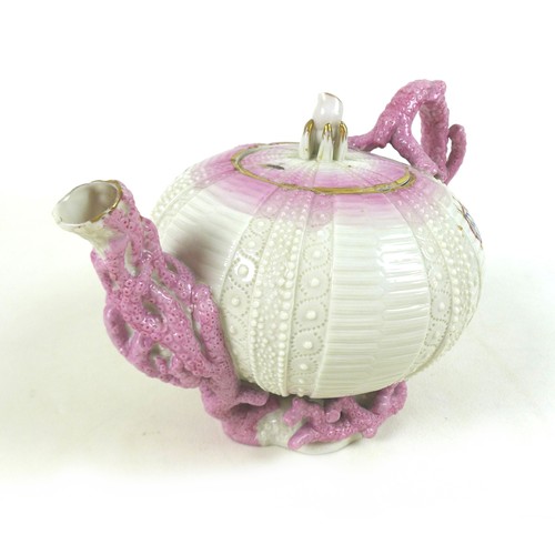 59 - A Belleek Echinus teapot with pink coral detail, decorated with gilt highlights and hand painted 'CM... 