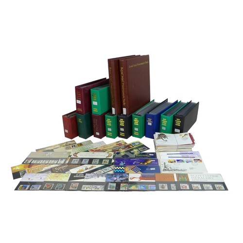 An extensive collection of over three hundred and fifty GB presentation packs spanning from 1978 to 2022, appearing to be a mostly complete run with some duplication, including Star Wars, Harry Potter, London 2012 Olympics, and horseracing, together with a quantity of GB first day covers/FDCs, over sixty-five Australian FDCs (including two coin covers), and an uncirculated Australian $5 and $10 note. (2 boxes)