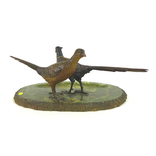 112 - An early 20th century onyx desk stand, decorated with a brace of cold painted bronze pheasants, the ... 