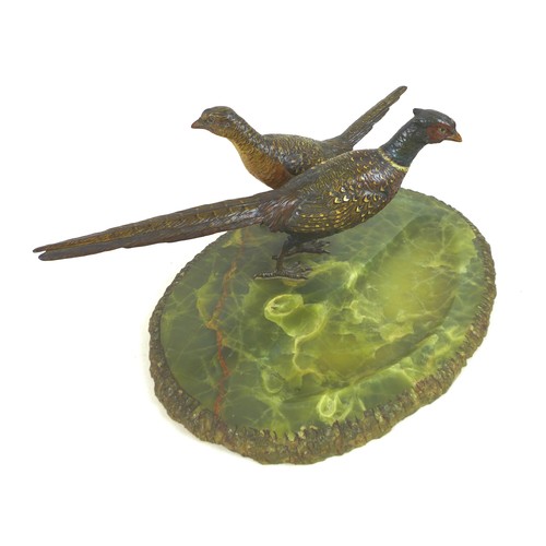 112 - An early 20th century onyx desk stand, decorated with a brace of cold painted bronze pheasants, the ... 