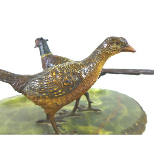 112 - An early 20th century onyx desk stand, decorated with a brace of cold painted bronze pheasants, the ... 