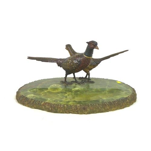 112 - An early 20th century onyx desk stand, decorated with a brace of cold painted bronze pheasants, the ... 