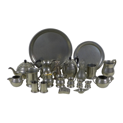 78 - A group of pewter items, including a circular tray, tea and coffee service, tankards, and sugar cast... 