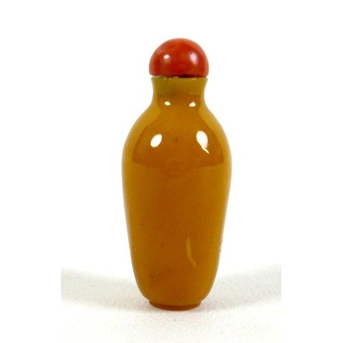 18 - A 19th century Chinese snuff bottle, mustard yellow coloured stone, or possibly Peking glass, taperi... 