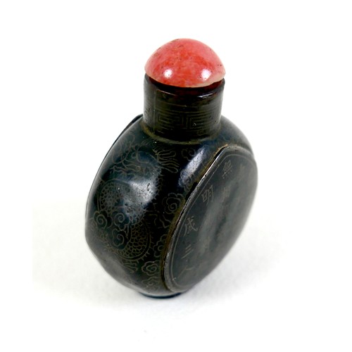 17 - A 19th century Chinese snuff bottle, metal and black enamel, ovoid form with two inscribed panels fr... 