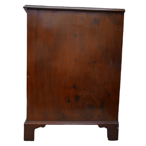 410 - A George III mahogany kneehole desk, with seven drawers each with ring handles, cupboard to kneehole... 