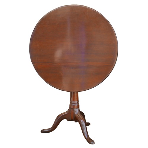 388 - A George III style mahogany round tilt top table, with birds nest support, raised upon a tripod base... 