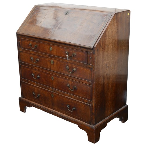 393 - A George III walnut bureau, with boxwood strung decoration, its fall front opening reveals a fitted ... 