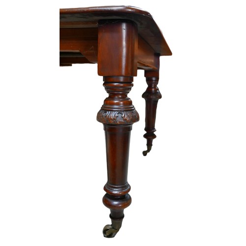 406 - A 19th century mahogany extending dining table, with two additional leaves, turned legs with relief ... 