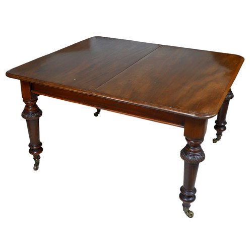 406 - A 19th century mahogany extending dining table, with two additional leaves, turned legs with relief ... 