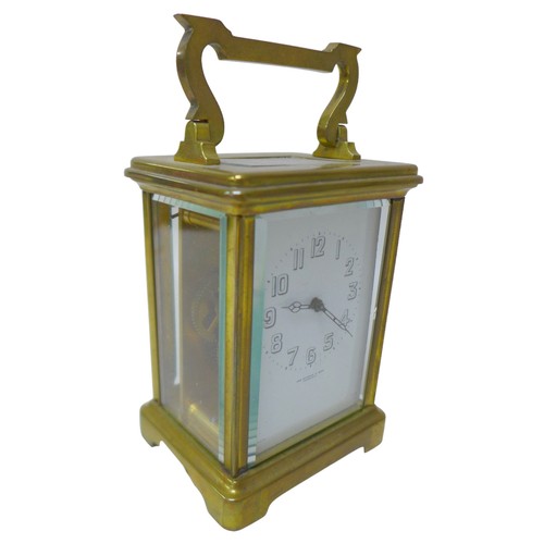 125 - A small brass carriage clock by JAS Ritchie & Son of Edinburgh, with Arabic numeral dial, with key, ... 