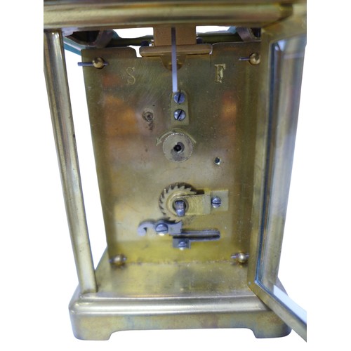 125 - A small brass carriage clock by JAS Ritchie & Son of Edinburgh, with Arabic numeral dial, with key, ... 